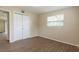 Bedroom with window and closet at 4129 Highland Loop, New Port Richey, FL 34652