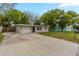 Charming single-story home featuring a spacious front yard, long driveway and attached single car garage at 4129 Highland Loop, New Port Richey, FL 34652