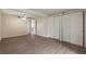 View of living room with hardwood floors and two closets at 4129 Highland Loop, New Port Richey, FL 34652