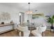 Dining room with modern light fixture, round table, and six chairs, perfect for entertaining and Gathering meals at 5303 Glen Harwell Rd, Plant City, FL 33566