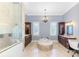 Elegant bathroom with standalone tub, separate vanities, and walk-in shower at 1570 Oakford Rd, Sarasota, FL 34240