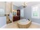 Bright bathroom with standalone tub, walk-in shower and ample vanity space at 1570 Oakford Rd, Sarasota, FL 34240