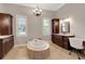Elegant bathroom features standalone tub, chandelier, and natural lighting at 1570 Oakford Rd, Sarasota, FL 34240
