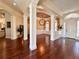 Dining room with dark wood floors, unique ceiling treatment, and designer lighting at 1570 Oakford Rd, Sarasota, FL 34240