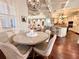 Inviting dining area with hardwood floors and open kitchen design for modern living at 1570 Oakford Rd, Sarasota, FL 34240