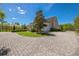 The property features a circular driveway with an attached two-car garage at 1570 Oakford Rd, Sarasota, FL 34240