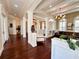 Spacious foyer with dark hardwood floors, architectural columns, and abundant natural light at 1570 Oakford Rd, Sarasota, FL 34240