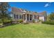 Charming home with lush landscaping, American flag, and a spacious front yard at 1570 Oakford Rd, Sarasota, FL 34240