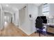 Hallway with hardwood floors and a built-in desk area with stylish decor at 1570 Oakford Rd, Sarasota, FL 34240
