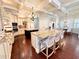Open kitchen with island seating, granite countertops, custom cabinets and stainless appliances at 1570 Oakford Rd, Sarasota, FL 34240