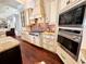 Well-equipped kitchen featuring stainless steel appliances, brick backsplash, and granite countertops at 1570 Oakford Rd, Sarasota, FL 34240