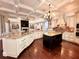 Spacious kitchen featuring a coffered ceiling, granite countertops, and a center island at 1570 Oakford Rd, Sarasota, FL 34240
