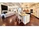 Open floorplan showcasing the kitchen island, hardwood floors, and living room fireplace at 1570 Oakford Rd, Sarasota, FL 34240