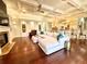 Elegant living room flows into the kitchen area and features a fireplace and beautiful ceiling at 1570 Oakford Rd, Sarasota, FL 34240