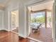 Screened patio offers brick flooring, outdoor seating, and access to the pool area at 1570 Oakford Rd, Sarasota, FL 34240
