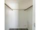 Walk-in closet with basic shelving and clothing rods at 10105 Vineyard Ln, Port Richey, FL 34668
