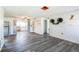 Bright and airy living room featuring sleek gray flooring, custom cat accessories, and an open floor plan at 10105 Vineyard Ln, Port Richey, FL 34668