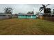 Exterior view of this turquoise single-story home with a spacious backyard, great for outdoor living at 2155 Webber St, Sarasota, FL 34239