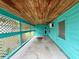 Covered patio with lattice and wood ceilings; an inviting outdoor retreat at 2155 Webber St, Sarasota, FL 34239