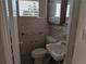 Bathroom features a vanity and a window that brings in natural light at 2155 Wood St # B4, Sarasota, FL 34237