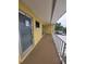 Exterior entryway shows a secure door, access to parking, and a well-lit and covered walkway for residents at 2155 Wood St # B4, Sarasota, FL 34237