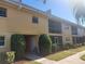 A charming two-story home features a well-maintained lawn and verdant shrubbery at 2155 Wood St # B4, Sarasota, FL 34237