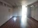 Bright living room with wood floors, shelving, and recessed lighting for a flexible space at 2155 Wood St # B4, Sarasota, FL 34237