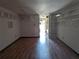 Spacious living room with hardwood floors and modern lighting at 2155 Wood St # B4, Sarasota, FL 34237