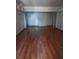 Spacious living room with ample natural light and wood laminate flooring at 2155 Wood St # B4, Sarasota, FL 34237