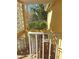 Stairwell with breeze block wall, trees and other foliage in view at 2155 Wood St # B4, Sarasota, FL 34237