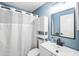 Clean bathroom with a shower, and updated sink with storage at 13004 Waterbourne Dr, Gibsonton, FL 33534