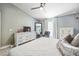 Bright bedroom with a ceiling fan, closet and dresser at 13004 Waterbourne Dr, Gibsonton, FL 33534