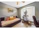 Bright room featuring a daybed, large window, and display shelves at 13004 Waterbourne Dr, Gibsonton, FL 33534