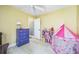 Playful room with a pink tent and a colorful bookshelf at 13004 Waterbourne Dr, Gibsonton, FL 33534
