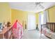 Comfortable room with light hardwood floors and yellow walls at 13004 Waterbourne Dr, Gibsonton, FL 33534
