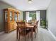 Dining room features a wooden table and a large cabinet for storage at 13004 Waterbourne Dr, Gibsonton, FL 33534