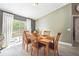 Sunlit dining room with sliding door access to the outdoor area at 13004 Waterbourne Dr, Gibsonton, FL 33534