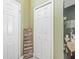 Hallway with a 'Home' art piece in front of bi-fold closet doors at 13004 Waterbourne Dr, Gibsonton, FL 33534