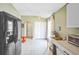 Bright kitchen features modern appliances and a neutral color palette at 13004 Waterbourne Dr, Gibsonton, FL 33534