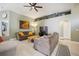 Inviting living room with vaulted ceilings, contemporary decor, neutral paint, and ample seating at 13004 Waterbourne Dr, Gibsonton, FL 33534