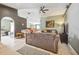Spacious living room featuring tile floors, an arched entry, and a seamless transition to the kitchen and dining area at 13004 Waterbourne Dr, Gibsonton, FL 33534