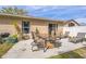 Outdoor patio area with table, grill, and seating under blue skies at 13004 Waterbourne Dr, Gibsonton, FL 33534