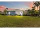 Beautiful backyard featuring a lush green lawn and manicured garden at 13136 Peregrin Cir, Bradenton, FL 34212