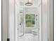 Well-lit bathroom with separate tub, shower, and a large window showcasing the outdoor view at 13136 Peregrin Cir, Bradenton, FL 34212