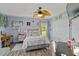 Cozy bedroom features a decorative fan, a colorful comforter, and a serene atmosphere at 13136 Peregrin Cir, Bradenton, FL 34212