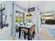 Bright breakfast nook with sliding glass doors leading to a screened-in pool area at 13136 Peregrin Cir, Bradenton, FL 34212