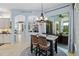 Casual eat in kitchen space with dining table and exterior patio in the background, providing a bright area at 13136 Peregrin Cir, Bradenton, FL 34212