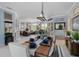 Open dining room with modern decor, dining table set, and open floorplan at 13136 Peregrin Cir, Bradenton, FL 34212