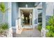 Inviting front entrance with double doors, stone pillars, and open view into the home at 13136 Peregrin Cir, Bradenton, FL 34212