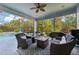 Outdoor screened in patio with comfortable seating area and barbecue grill at 13136 Peregrin Cir, Bradenton, FL 34212